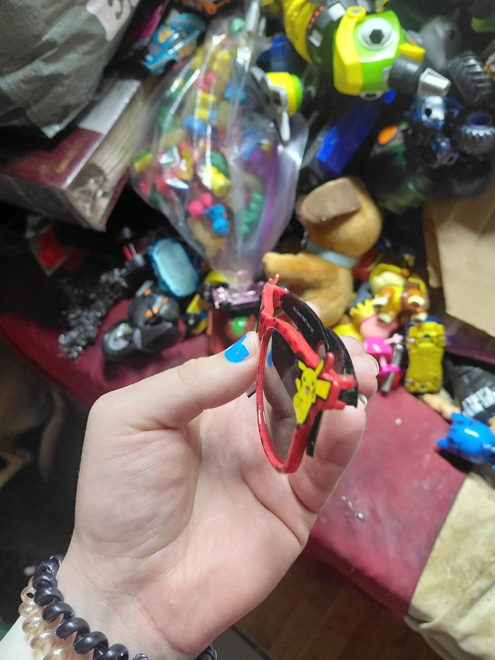 Nintendo Pokémon Pikachu sunglasses feature a red frame with a Poké Ball pattern